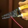 imageKlein Tools K1412 Wire Cutter  Stripper Made in USA Dual NM Cable Stripper and Cutter for Solid Copper Strips 12 and 14 AWGNMB Cable